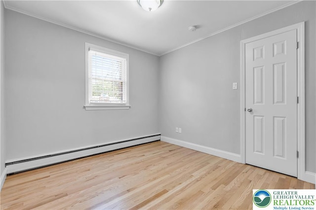 3032 W Woodlawn St, South Whitehall Twp, PA 18104 - unfurnished room with baseboard heating, crown molding, wood finished floors, and a smoke detector