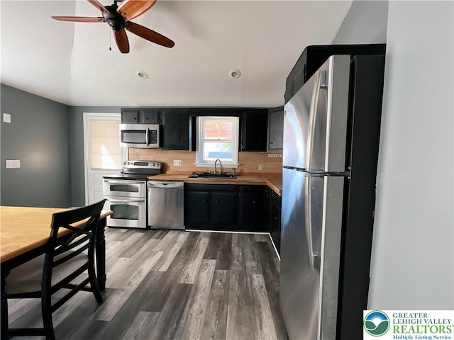 2236 2nd St, Easton, PA 18042 - kitchen with stainless steel appliances, dark cabinets, a ceiling fan, light countertops, and dark wood-style flooring