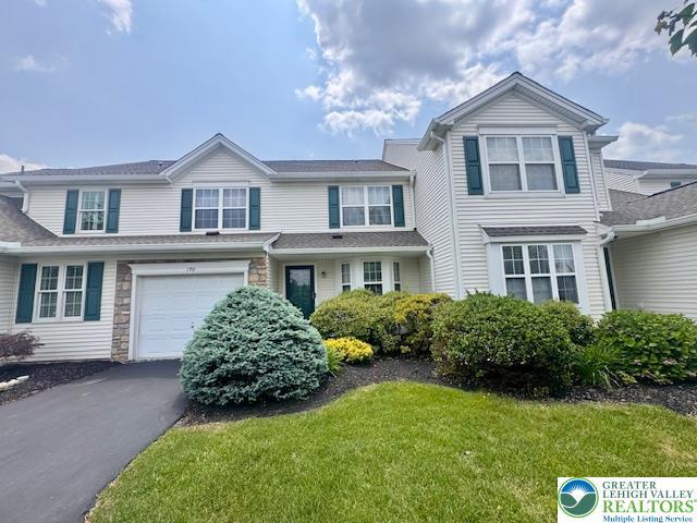 190 Park Ridge Dr, Forks Twp, PA 18040 - view of front of property with asphalt driveway, an attached garage, and a front lawn