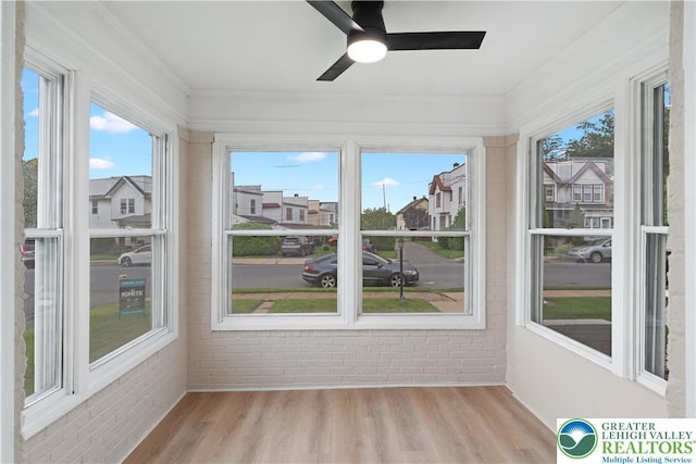 616 Highland Ave, Bethlehem City, PA 18018 - unfurnished sunroom featuring brick wall, wood finished floors, and ornamental molding