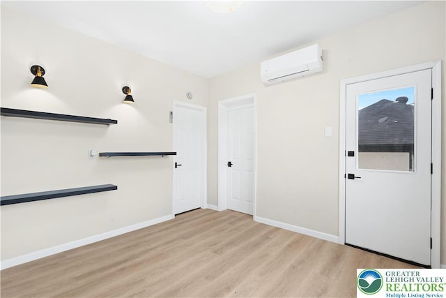616 Highland Ave, Bethlehem City, PA 18018 - interior space with a wall unit AC and light wood-style flooring