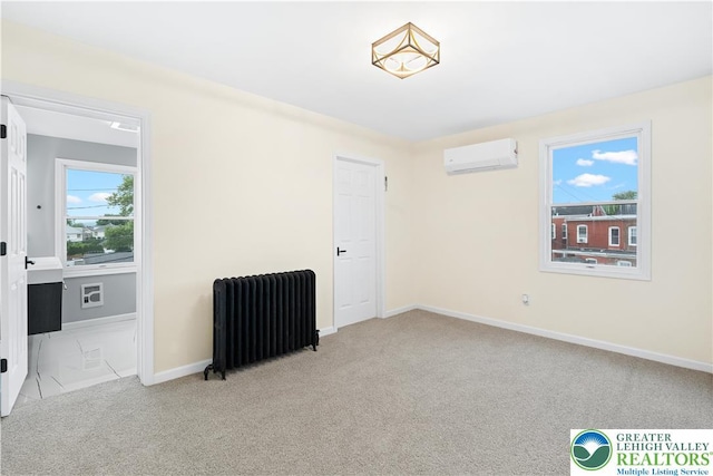 616 Highland Ave, Bethlehem City, PA 18018 - carpeted empty room featuring radiator and a wall unit AC