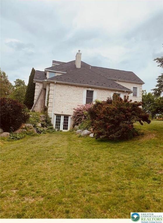 459 Mount Pleasant Rd, Washington Twp, PA 18013 - view of side of property featuring french doors, a yard, and a chimney