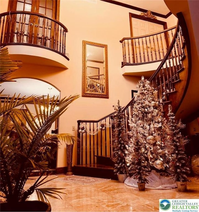 459 Mount Pleasant Rd, Washington Twp, PA 18013 - staircase featuring marble tiled floors, ornamental molding, and a high ceiling