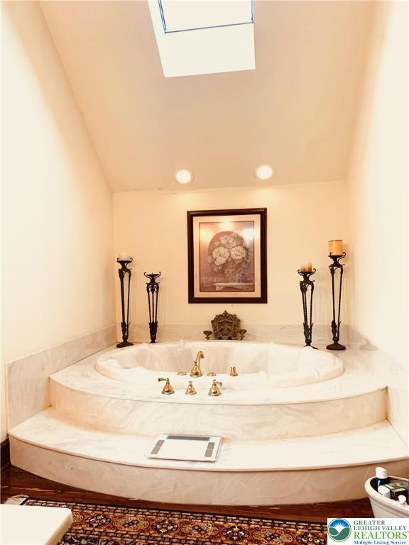 459 Mount Pleasant Rd, Washington Twp, PA 18013 - full bathroom with a garden tub, lofted ceiling, a skylight, and recessed lighting