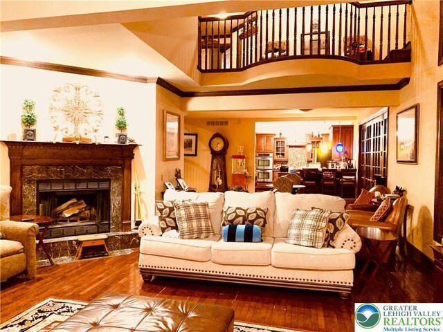 459 Mount Pleasant Rd, Washington Twp, PA 18013 - living area with wood finished floors, crown molding, and a fireplace