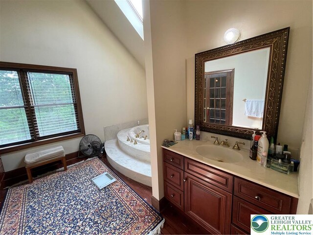 459 Mount Pleasant Rd, Washington Twp, PA 18013 - bathroom with vanity, a garden tub, and wood finished floors