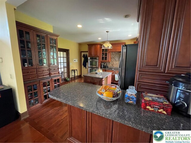 459 Mount Pleasant Rd, Washington Twp, PA 18013 - kitchen featuring stainless steel appliances, a kitchen island, dark wood-style floors, recessed lighting, and glass insert cabinets