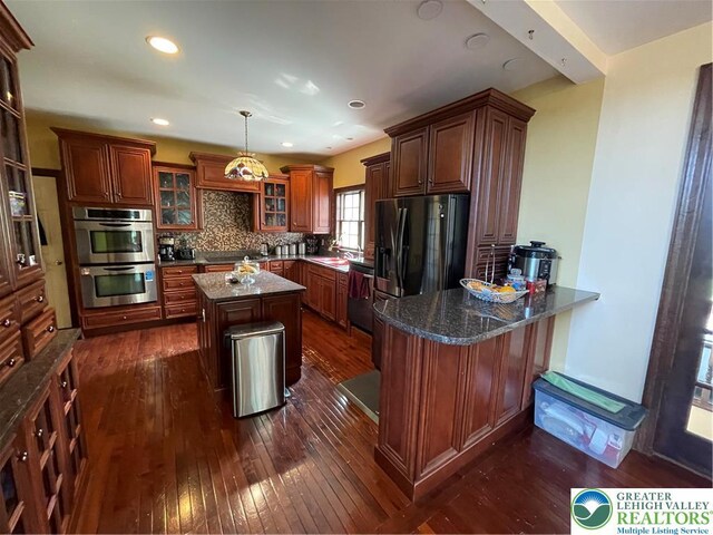 459 Mount Pleasant Rd, Washington Twp, PA 18013 - kitchen featuring black appliances, dark wood finished floors, glass insert cabinets, a peninsula, and recessed lighting