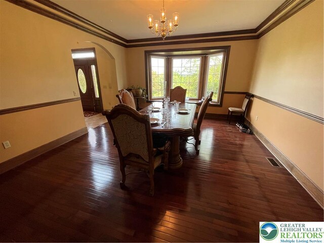 459 Mount Pleasant Rd, Washington Twp, PA 18013 - dining room featuring a chandelier, crown molding, arched walkways, and hardwood / wood-style flooring