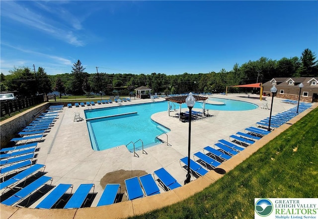 8237 Natures Dr, Coolbaugh Twp, PA 18466 - community pool featuring a patio area and view of scattered trees
