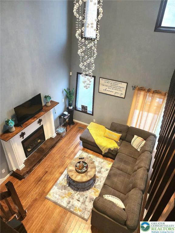 8237 Natures Dr, Coolbaugh Twp, PA 18466 - living area with a high ceiling and wood finished floors