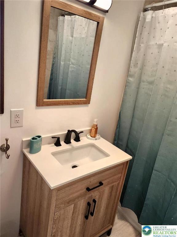 8237 Natures Dr, Coolbaugh Twp, PA 18466 - full bath featuring vanity and a shower with shower curtain