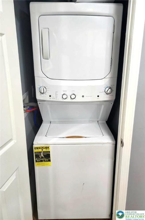 8237 Natures Dr, Coolbaugh Twp, PA 18466 - washroom featuring stacked washer and clothes dryer