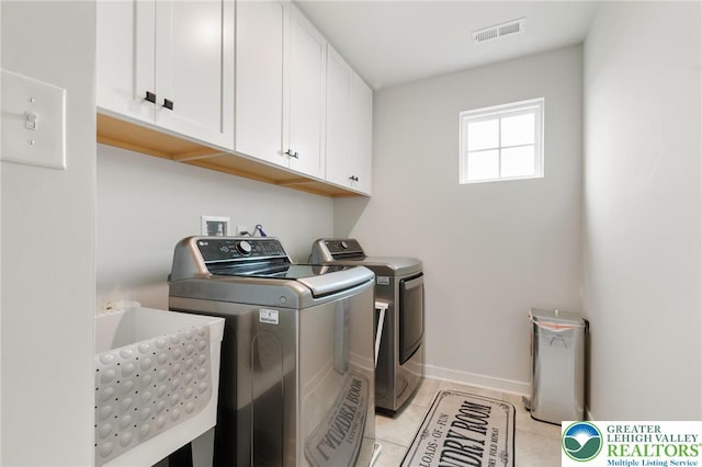 1615 Watson Loop, Upper Macungie Twp, PA 18051 - laundry area featuring cabinet space, independent washer and dryer, and light tile patterned floors