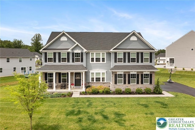 1615 Watson Loop, Upper Macungie Twp, PA 18051 - view of front of home with a porch, a front lawn, stone siding, and a shingled roof