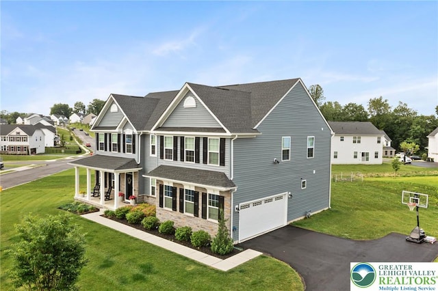 1615 Watson Loop, Upper Macungie Twp, PA 18051 - view of front of property with roof with shingles, a front lawn, a residential view, asphalt driveway, and a garage