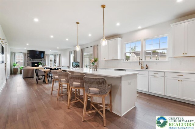 1615 Watson Loop, Upper Macungie Twp, PA 18051 - kitchen featuring a kitchen island, tasteful backsplash, recessed lighting, open floor plan, and wood finished floors