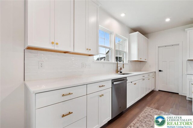 1615 Watson Loop, Upper Macungie Twp, PA 18051 - kitchen with stainless steel dishwasher, dark wood finished floors, white cabinetry, backsplash, and light countertops