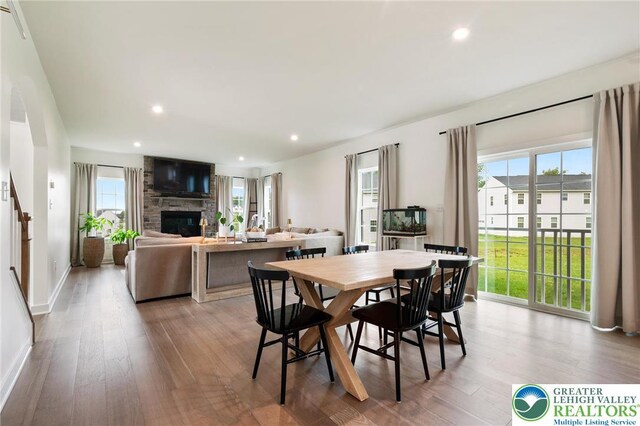 1615 Watson Loop, Upper Macungie Twp, PA 18051 - dining room with healthy amount of natural light, wood finished floors, a fireplace, and recessed lighting