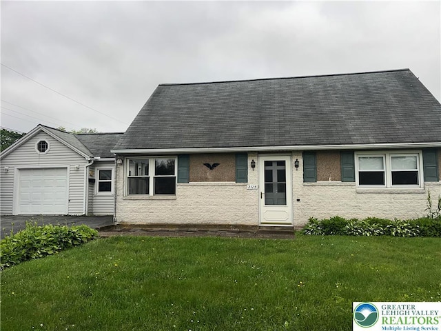 2115 Fireside Dr, Bethlehem City, PA 18018 - new england style home with an attached garage, a front lawn, a shingled roof, and asphalt driveway