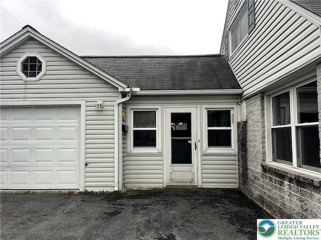 2115 Fireside Dr, Bethlehem City, PA 18018 - doorway to property with roof with shingles and a garage
