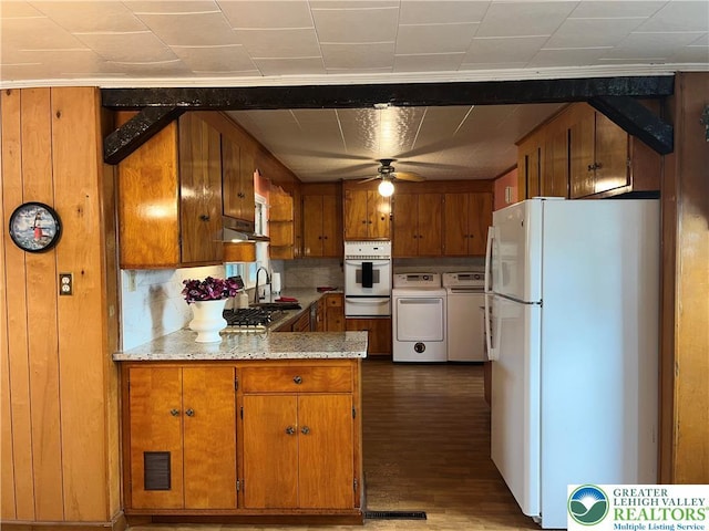 2115 Fireside Dr, Bethlehem City, PA 18018 - kitchen featuring white appliances, brown cabinetry, washing machine and dryer, and a ceiling fan