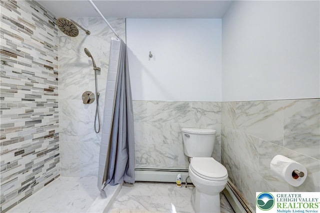 143 Cathleen Dr, Price Twp, PA 18302 - full bath featuring baseboard heating, tile walls, tiled shower, marble finish flooring, and a wainscoted wall