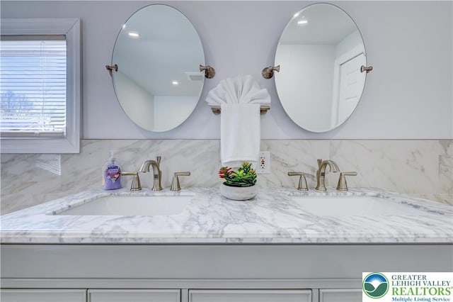 143 Cathleen Dr, Price Twp, PA 18302 - full bathroom featuring double vanity and decorative backsplash
