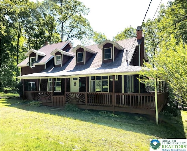 143 Cathleen Dr, Price Twp, PA 18302 - view of front of home featuring a front yard, a chimney, and a shingled roof