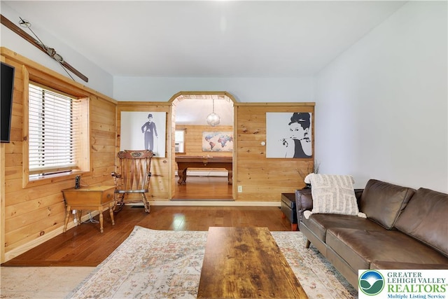 143 Cathleen Dr, Price Twp, PA 18302 - living room with wooden walls and hardwood / wood-style flooring