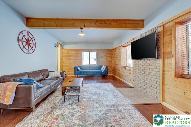 143 Cathleen Dr, Price Twp, PA 18302 - living room featuring hardwood / wood-style flooring, beam ceiling, and wood walls