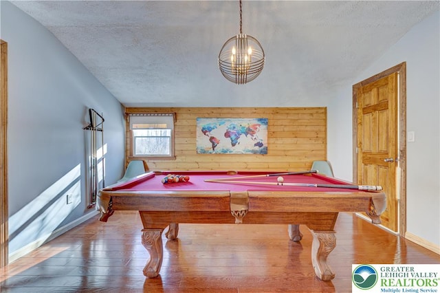 143 Cathleen Dr, Price Twp, PA 18302 - playroom featuring hardwood / wood-style flooring, a textured ceiling, pool table, a chandelier, and wooden walls