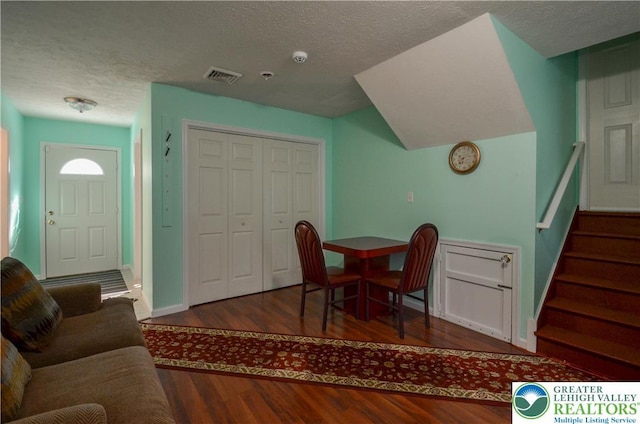 1214 Shadblow Rd, Tobyhanna Twp, PA 18346 - dining area featuring wood finished floors, a textured ceiling, and stairs