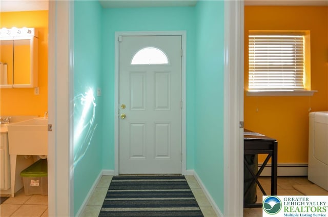 1214 Shadblow Rd, Tobyhanna Twp, PA 18346 - entryway featuring baseboard heating, washer / dryer, and light tile patterned floors
