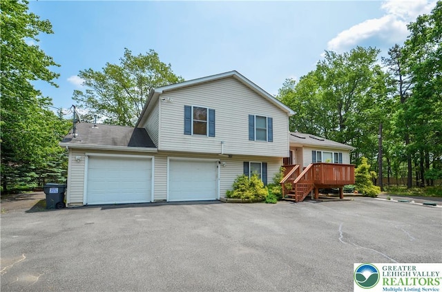 1214 Shadblow Rd, Tobyhanna Twp, PA 18346 - split level home featuring asphalt driveway, a wooden deck, and stairs