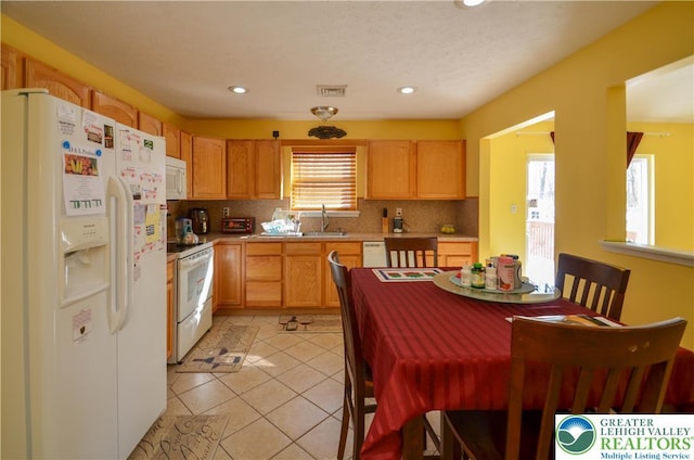 1214 Shadblow Rd, Tobyhanna Twp, PA 18346 - kitchen featuring white appliances, backsplash, light countertops, recessed lighting, and light tile patterned flooring