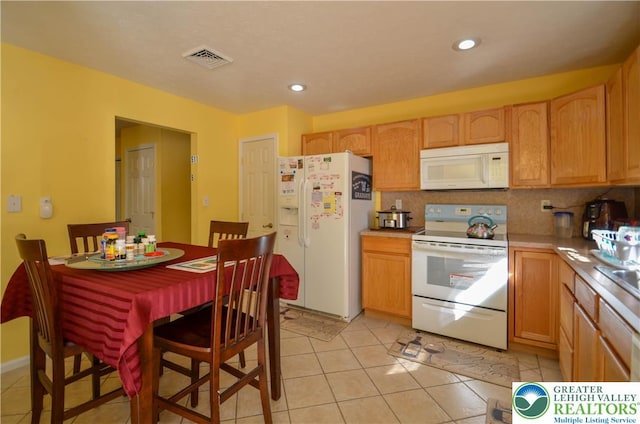 1214 Shadblow Rd, Tobyhanna Twp, PA 18346 - kitchen with white appliances, light countertops, tasteful backsplash, recessed lighting, and light tile patterned floors
