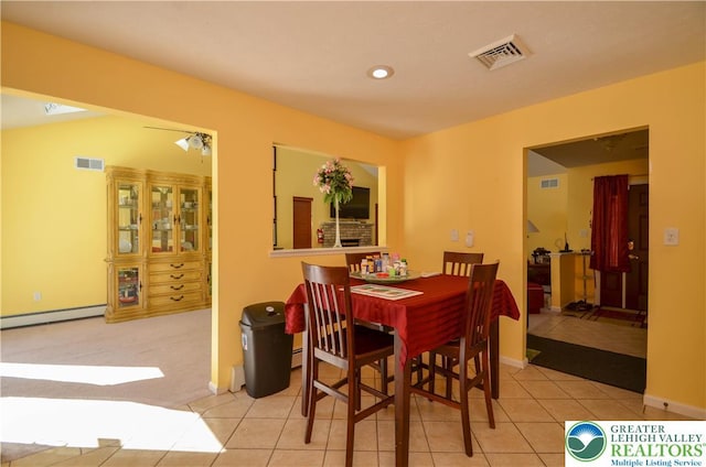 1214 Shadblow Rd, Tobyhanna Twp, PA 18346 - dining area with a baseboard radiator, tile patterned flooring, carpet flooring, and recessed lighting