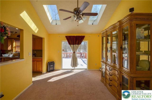 1214 Shadblow Rd, Tobyhanna Twp, PA 18346 - interior space with a skylight, light colored carpet, high vaulted ceiling, and ceiling fan