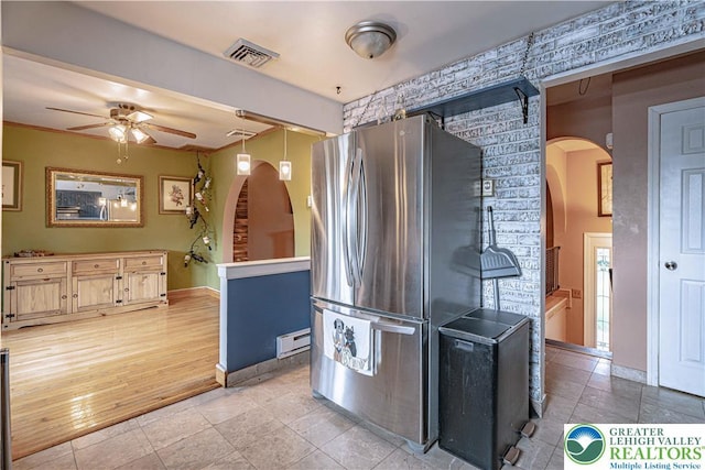 1421 7th St, Bethlehem Twp, PA 18020 - kitchen featuring freestanding refrigerator, arched walkways, ceiling fan, and baseboard heating