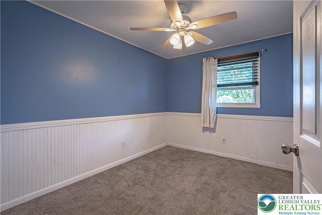 1421 7th St, Bethlehem Twp, PA 18020 - unfurnished room featuring a wainscoted wall, a ceiling fan, and carpet