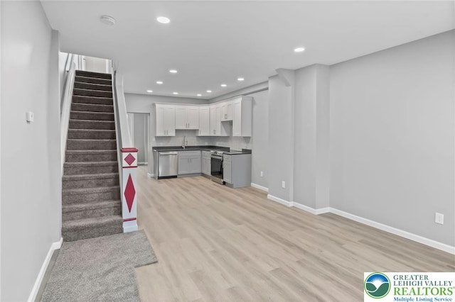 1478 E 5th St, Bethlehem City, PA 18015 - unfurnished living room featuring light wood finished floors, stairway, and recessed lighting