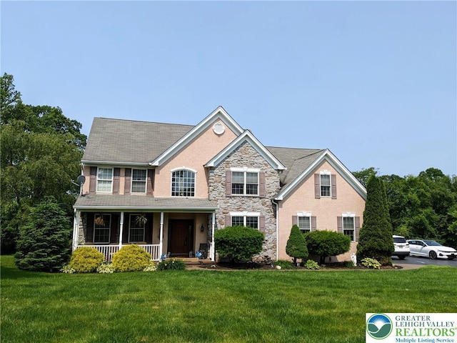 131 Winding Way, Washington Twp, PA 18013 - view of front of property featuring stone siding, covered porch, and a front yard