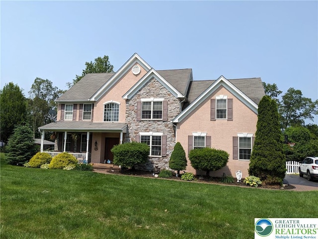 131 Winding Way, Washington Twp, PA 18013 - view of front of property with covered porch, a front yard, and stone siding