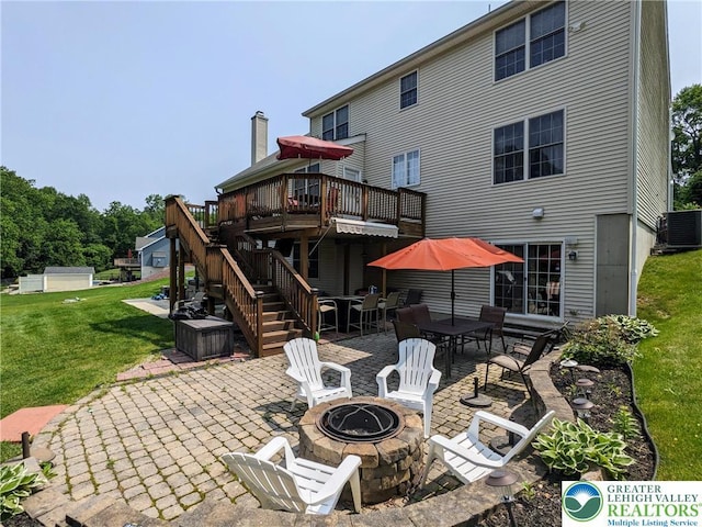 131 Winding Way, Washington Twp, PA 18013 - rear view of property featuring a fire pit, a patio area, a yard, a deck, and stairway