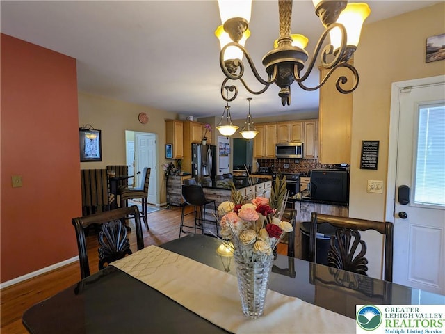 131 Winding Way, Washington Twp, PA 18013 - dining space with a chandelier and wood finished floors