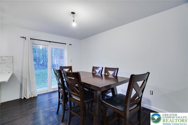 9436 Juniper Dr, Tobyhanna Twp, PA 18466 - dining area featuring dark wood-style flooring