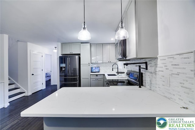 9436 Juniper Dr, Tobyhanna Twp, PA 18466 - kitchen with fridge with ice dispenser, black electric range, decorative backsplash, a peninsula, and light stone counters