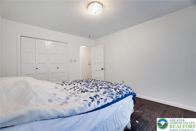 9436 Juniper Dr, Tobyhanna Twp, PA 18466 - bedroom with dark wood-type flooring and a closet